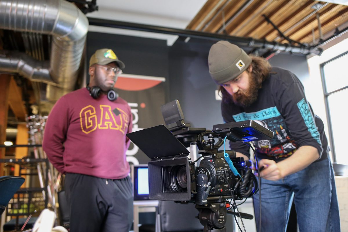 Two students building a camera rig in the InFocus studio